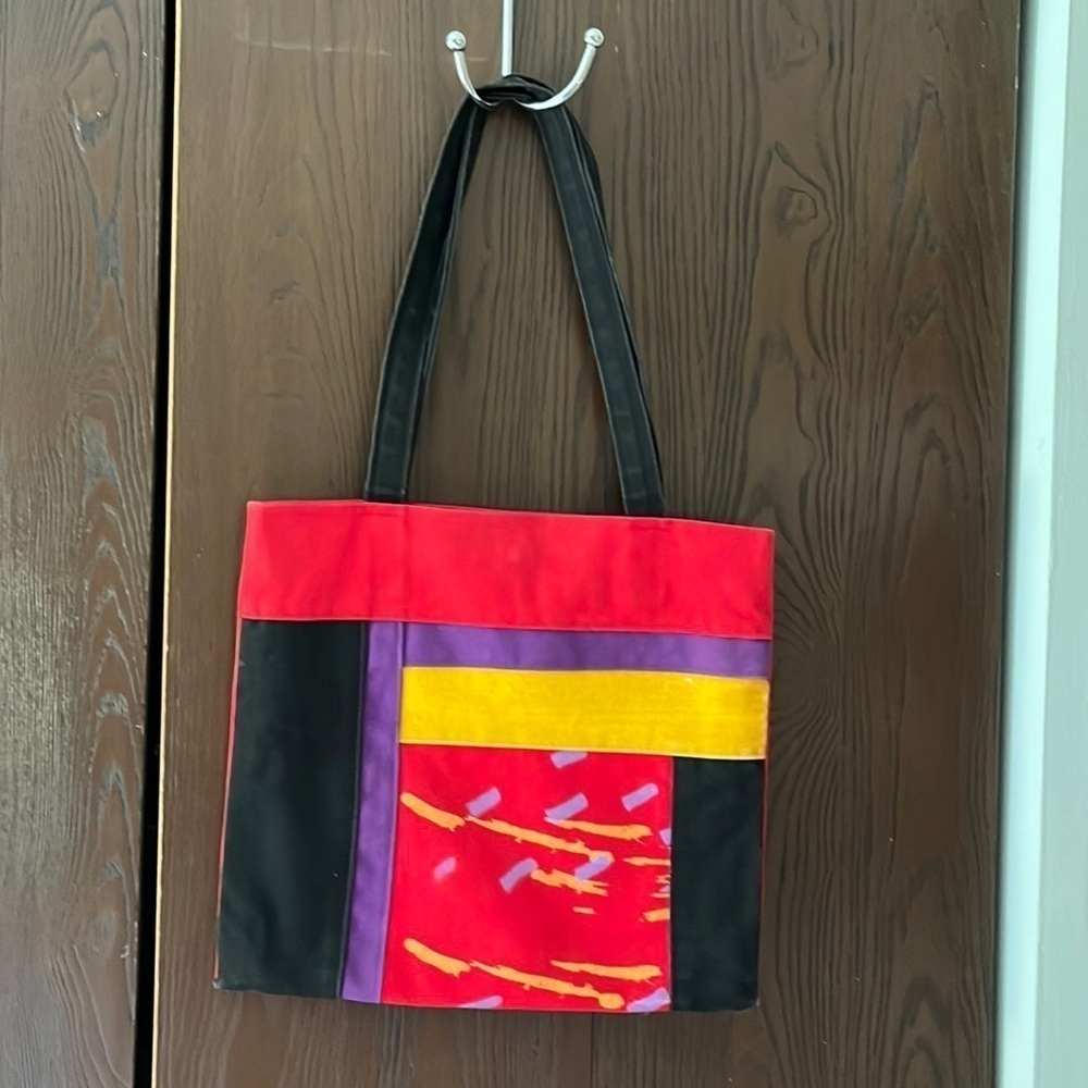 Bedouin  by Heekin Brockway red multicolored canvas purse.